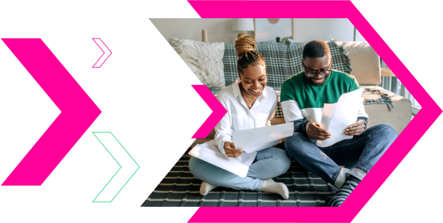 Man and woman reading papers